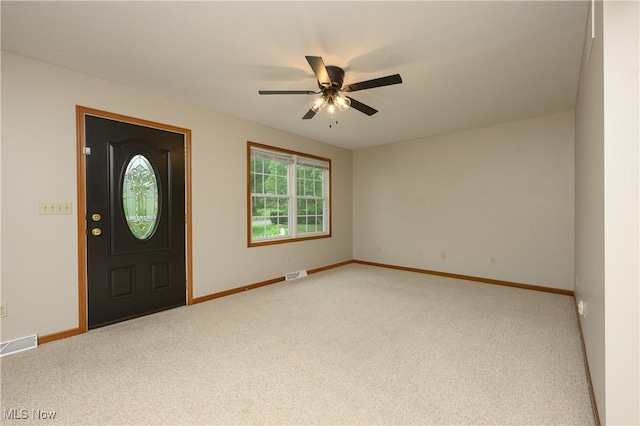 103 Beech St, Doylestown, OH 44230 - entrance foyer featuring light colored carpet, plenty of natural light, and ceiling fan