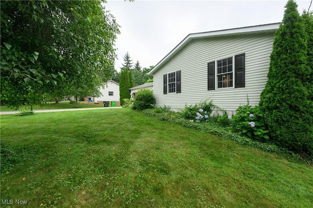 103 Beech St, Doylestown, OH 44230 - view of side of home featuring a yard