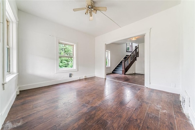 1150 W 5th St, Lorain, OH 44052 - empty room featuring stairs, hardwood / wood-style floors, and ceiling fan