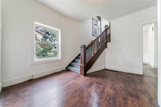 1150 W 5th St, Lorain, OH 44052 - stairs featuring wood-type flooring