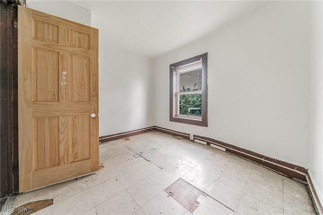 1150 W 5th St, Lorain, OH 44052 - spare room with baseboards