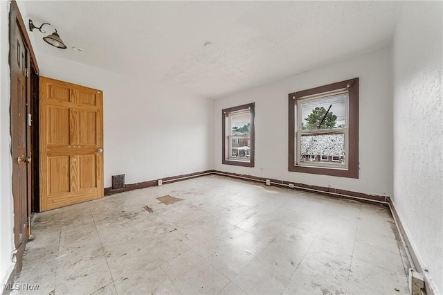 1150 W 5th St, Lorain, OH 44052 - spare room featuring baseboards
