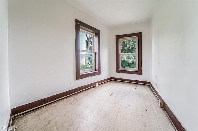 1150 W 5th St, Lorain, OH 44052 - empty room with baseboards