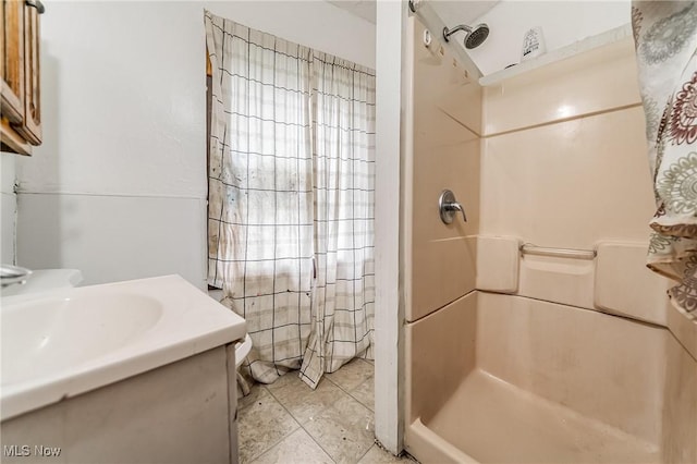 1150 W 5th St, Lorain, OH 44052 - full bathroom featuring a stall shower, vanity, and tile patterned flooring
