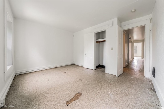 1150 W 5th St, Lorain, OH 44052 - unfurnished bedroom with a closet and baseboards