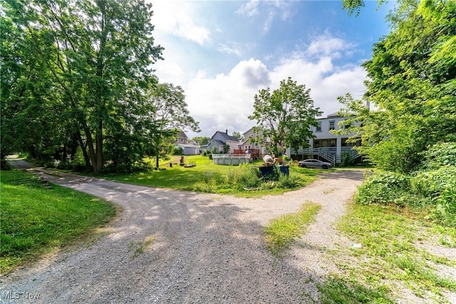 1150 W 5th St, Lorain, OH 44052 - view of dirt / gravel driveway featuring a residential view