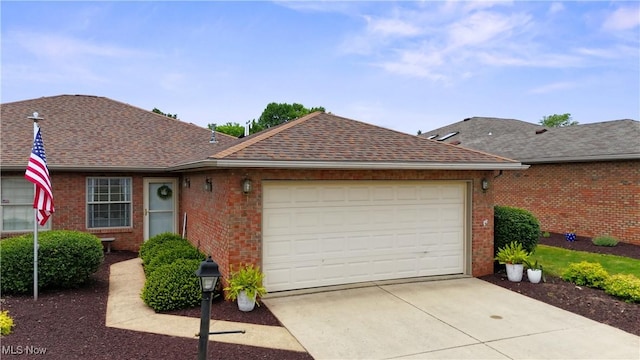 6 Wedgewood Dr, Willard, OH 44890 - ranch-style home with brick siding, a garage, driveway, and a shingled roof