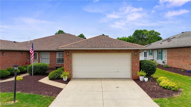 6 Wedgewood Dr, Willard, OH 44890 - ranch-style house featuring brick siding, an attached garage, concrete driveway, and roof with shingles