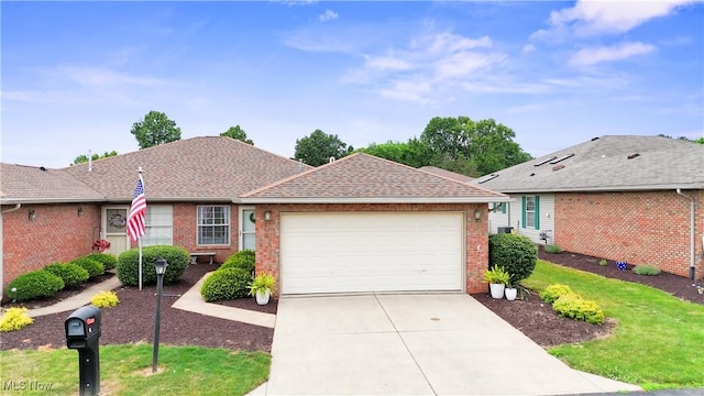 6 Wedgewood Dr, Willard, OH 44890 - single story home featuring brick siding, an attached garage, concrete driveway, and a front lawn