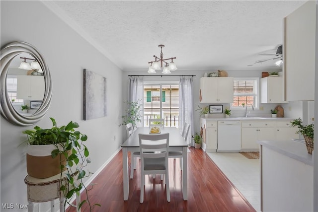 6 Wedgewood Dr, Willard, OH 44890 - dining space with a chandelier, light wood-type flooring, a textured ceiling, and ceiling fan