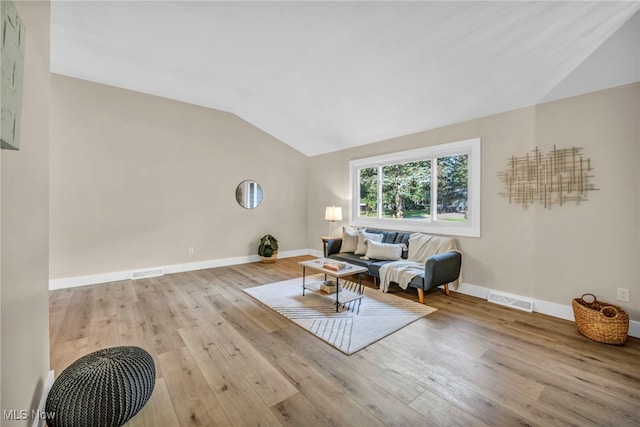 4499 Camellia Ln, North Olmsted, OH 44070 - living area featuring vaulted ceiling and hardwood / wood-style flooring