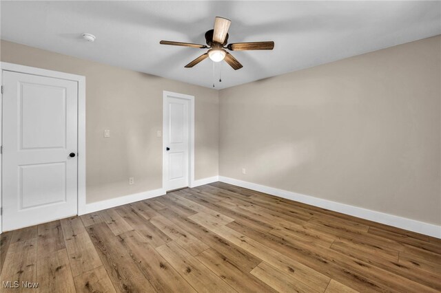 4499 Camellia Ln, North Olmsted, OH 44070 - unfurnished bedroom featuring hardwood / wood-style floors and a ceiling fan