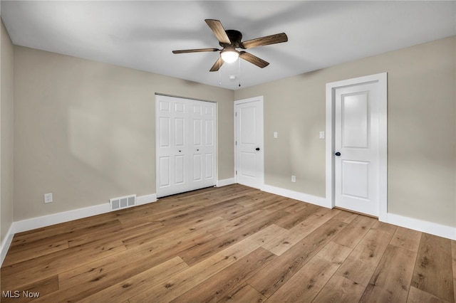 4499 Camellia Ln, North Olmsted, OH 44070 - unfurnished bedroom featuring hardwood / wood-style flooring, ceiling fan, and a closet