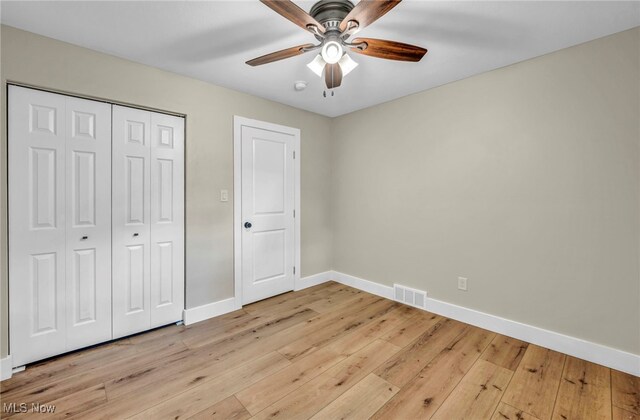 4499 Camellia Ln, North Olmsted, OH 44070 - unfurnished bedroom featuring light wood-type flooring, a closet, and ceiling fan