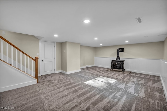 4499 Camellia Ln, North Olmsted, OH 44070 - finished basement featuring carpet flooring, a wood stove, stairs, and recessed lighting