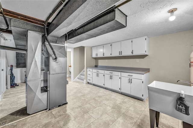 4499 Camellia Ln, North Olmsted, OH 44070 - below grade area featuring heating unit, a textured ceiling, and stairs