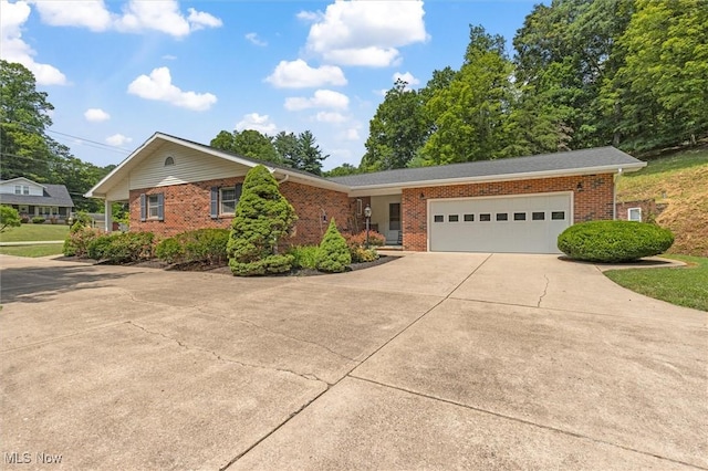 33362 State Route 833, Pomeroy, OH 45769 - view of front of property with brick siding, concrete driveway, and an attached garage