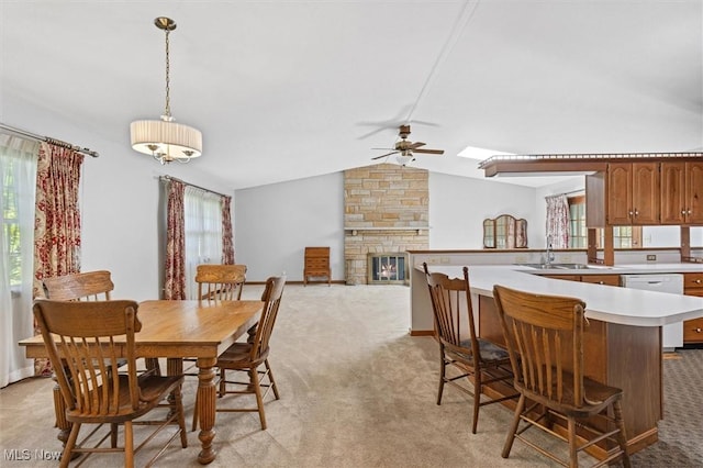 33362 State Route 833, Pomeroy, OH 45769 - dining room featuring light carpet, a ceiling fan, lofted ceiling, and a stone fireplace