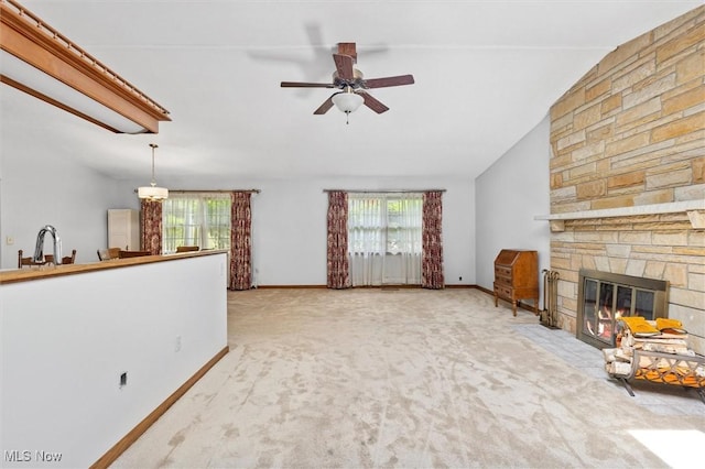 33362 State Route 833, Pomeroy, OH 45769 - unfurnished living room with carpet floors, a ceiling fan, a stone fireplace, and vaulted ceiling