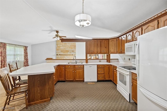 33362 State Route 833, Pomeroy, OH 45769 - kitchen featuring white appliances, lofted ceiling, a peninsula, a ceiling fan, and brown cabinetry
