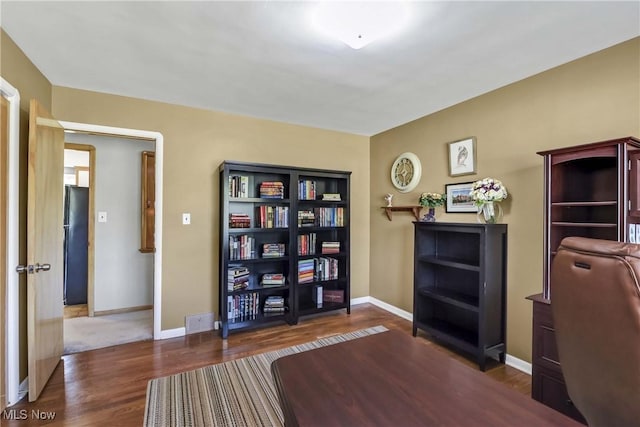6713 Mackenzie Rd, North Olmsted, OH 44070 - office featuring dark wood-style floors and baseboards