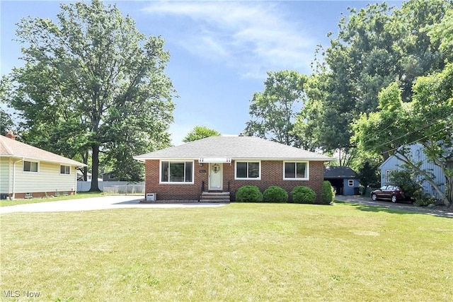 6713 Mackenzie Rd, North Olmsted, OH 44070 - view of front of property featuring brick siding and a front yard