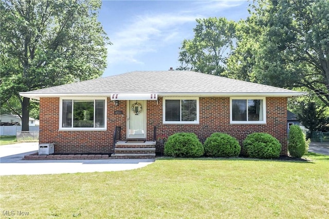 6713 Mackenzie Rd, North Olmsted, OH 44070 - bungalow-style house with brick siding and a shingled roof