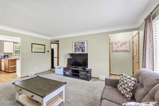 6713 Mackenzie Rd, North Olmsted, OH 44070 - living room with light colored carpet and baseboards