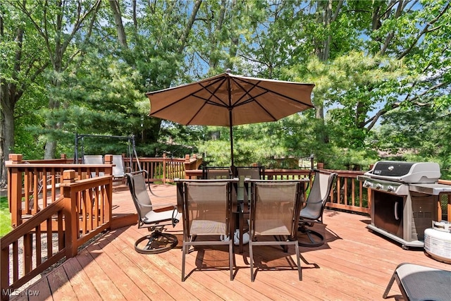 525 Bishop Pl, Berea, OH 44017 - wooden terrace with a grill, outdoor dining area, and view of scattered trees