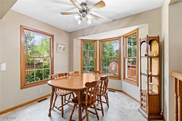 525 Bishop Pl, Berea, OH 44017 - dining space featuring plenty of natural light, a ceiling fan, and light carpet