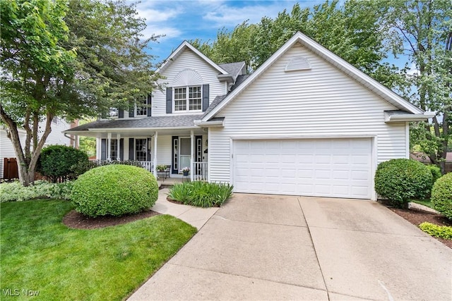 525 Bishop Pl, Berea, OH 44017 - traditional-style house with covered porch, a garage, concrete driveway, a front lawn, and roof with shingles