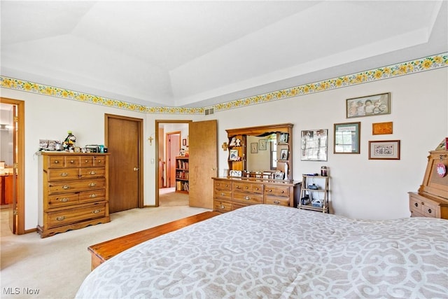 525 Bishop Pl, Berea, OH 44017 - bedroom featuring light colored carpet, a raised ceiling, and ensuite bathroom