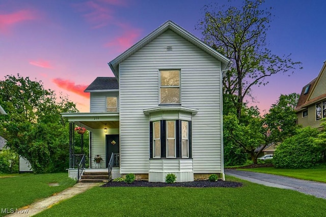 235 Elm St, Oberlin, OH 44074 - traditional home featuring covered porch and a front lawn