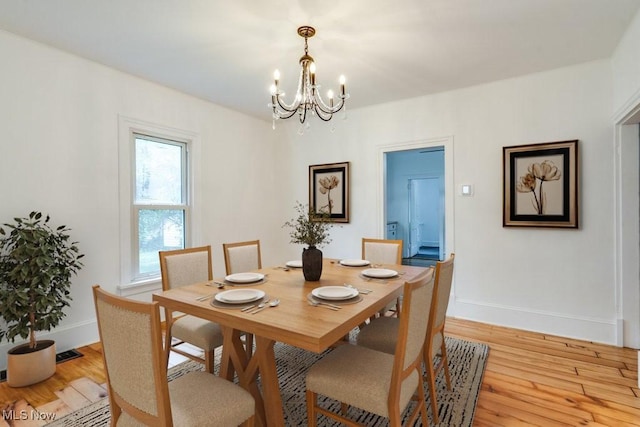 235 Elm St, Oberlin, OH 44074 - dining space featuring a chandelier and light wood-type flooring