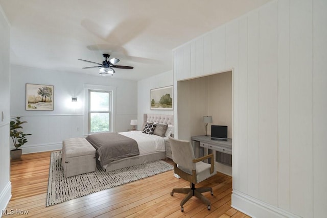 235 Elm St, Oberlin, OH 44074 - bedroom with light wood-style flooring, a decorative wall, ceiling fan, and an office area