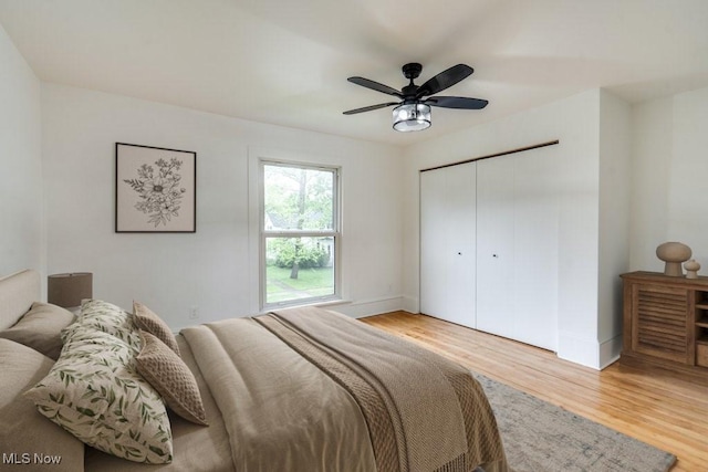 235 Elm St, Oberlin, OH 44074 - bedroom with wood finished floors, a closet, and a ceiling fan