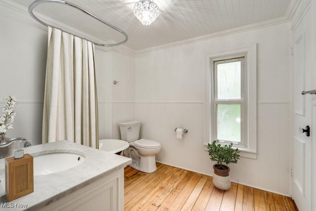235 Elm St, Oberlin, OH 44074 - full bathroom featuring hardwood / wood-style floors, wainscoting, vanity, crown molding, and a shower with curtain