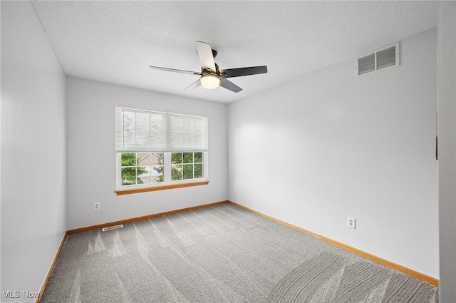 1036 Larkens Way, Medina, OH 44256 - spare room featuring a ceiling fan, carpet, and a textured ceiling
