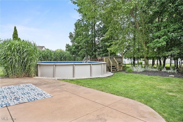 1036 Larkens Way, Medina, OH 44256 - view of green lawn featuring a wooden deck and an outdoor pool