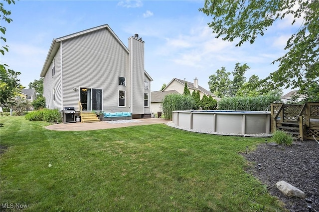 1036 Larkens Way, Medina, OH 44256 - back of property featuring a chimney, a lawn, entry steps, and a patio area