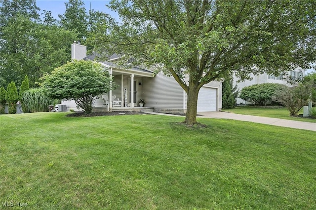 1036 Larkens Way, Medina, OH 44256 - obstructed view of property with concrete driveway, a front yard, an attached garage, and a chimney