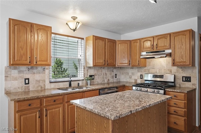 1036 Larkens Way, Medina, OH 44256 - kitchen featuring under cabinet range hood, stainless steel appliances, a kitchen island, a textured ceiling, and tasteful backsplash