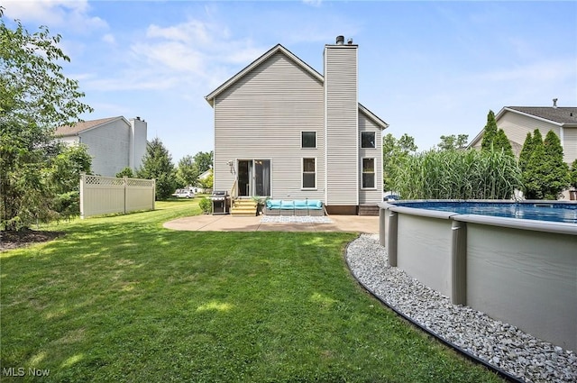 1036 Larkens Way, Medina, OH 44256 - back of property with entry steps, a chimney, a patio area, and an outdoor pool