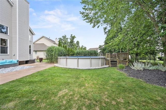 1036 Larkens Way, Medina, OH 44256 - view of green lawn with a wooden deck, an outdoor pool, and outdoor lounge area