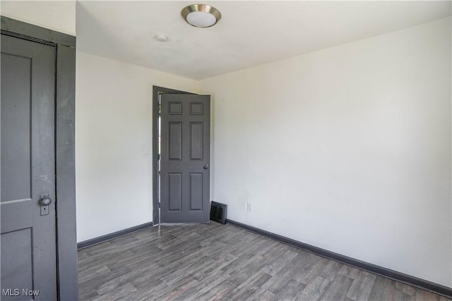 1384 Stark Ave SW, Canton, OH 44706 - spare room with wood finished floors and baseboards