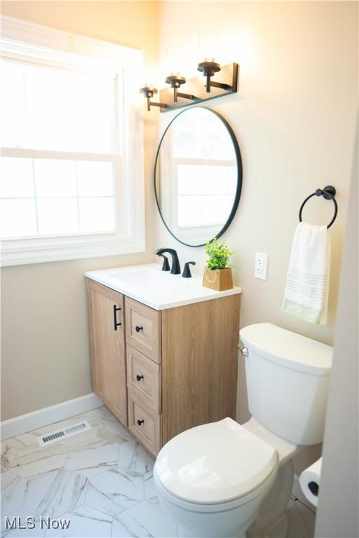5699 Colgate Ave, Austintown, OH 44515 - half bath featuring vanity and marble look tile flooring
