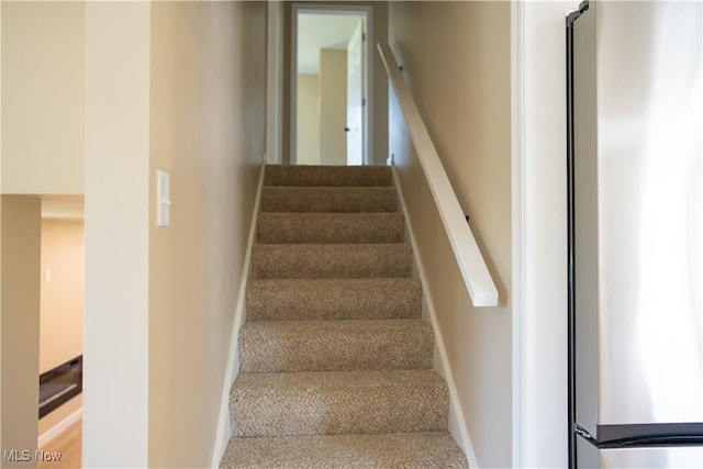 5699 Colgate Ave, Austintown, OH 44515 - staircase featuring carpet