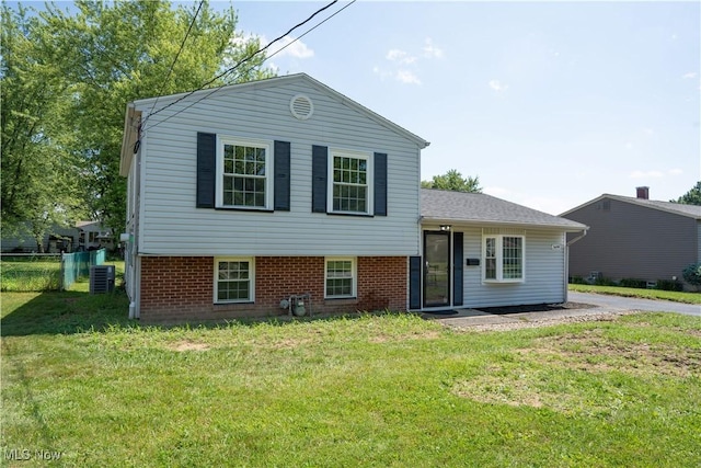 5699 Colgate Ave, Austintown, OH 44515 - split level home featuring a front lawn and brick siding