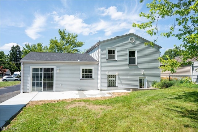 5699 Colgate Ave, Austintown, OH 44515 - back of house featuring a lawn and a patio area