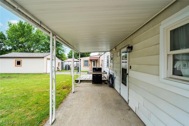 162 N Beverly Ave, Youngstown, OH 44515 - view of patio with an attached carport, an outbuilding, and grilling area